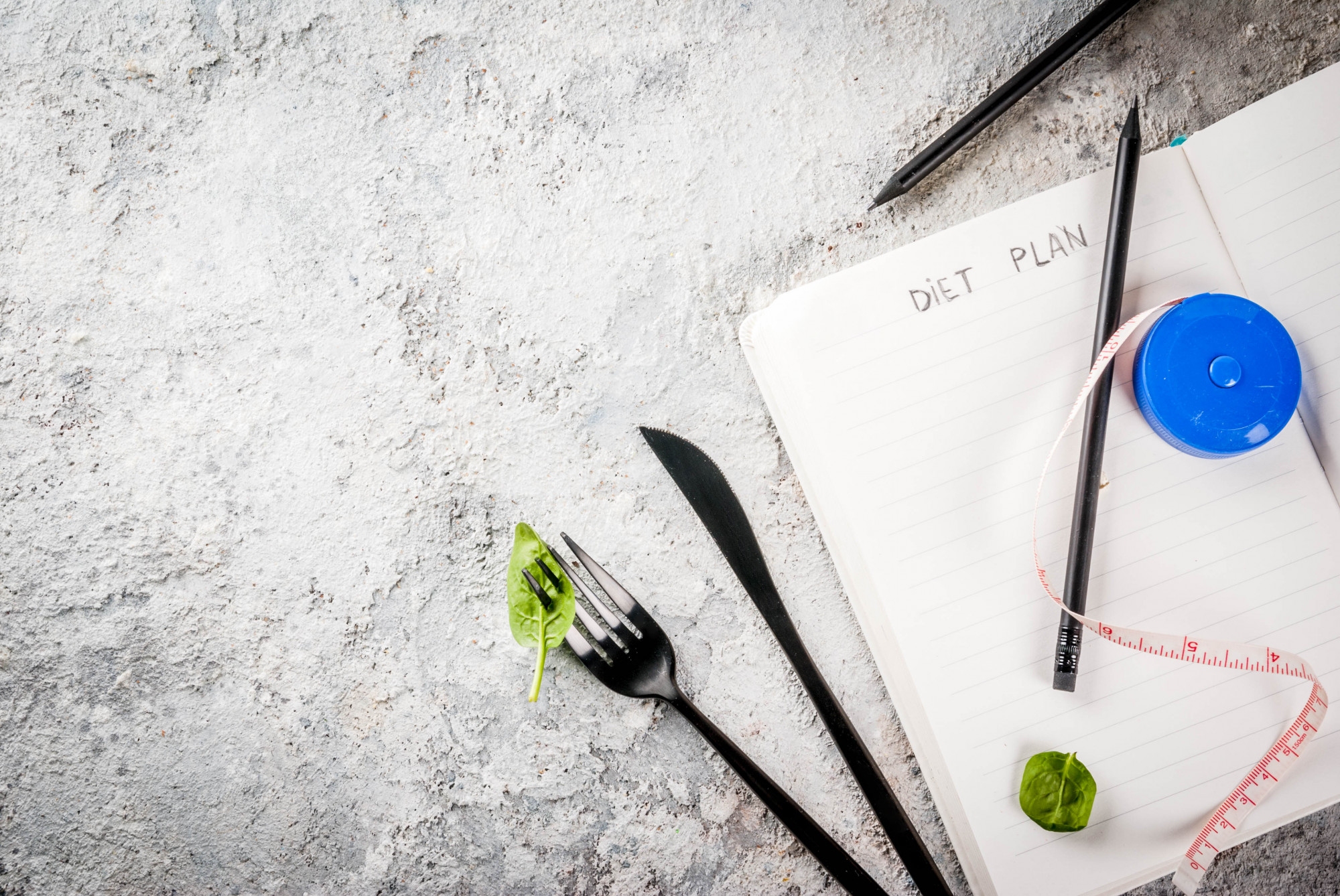 Chef sketching menu concepts on paper