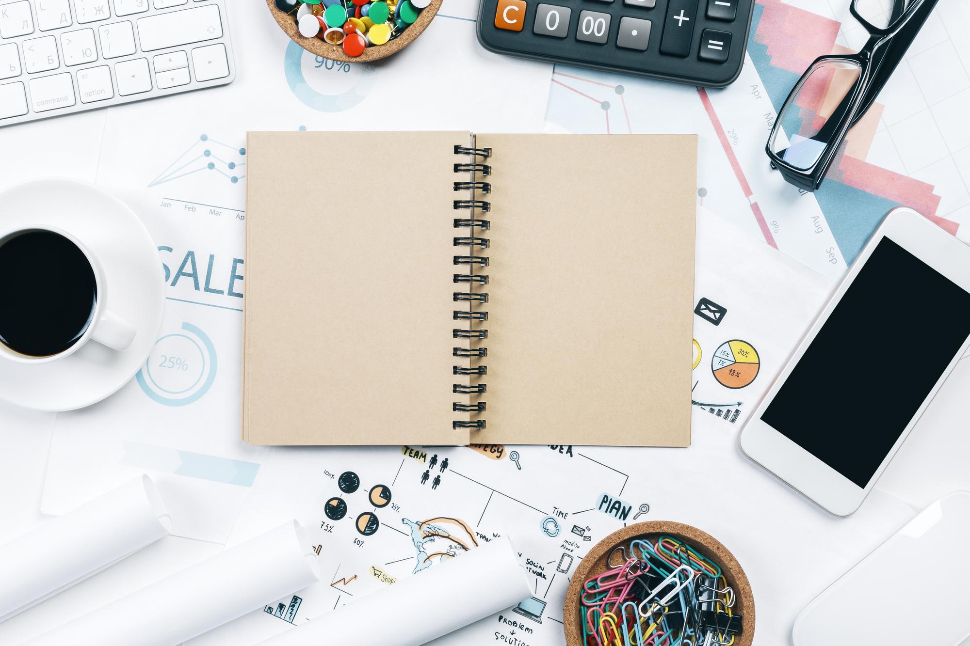 Notepad with menu sketches and cost model